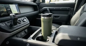 Modern matte travel mug fitting perfectly into a standard vehicle cup holder